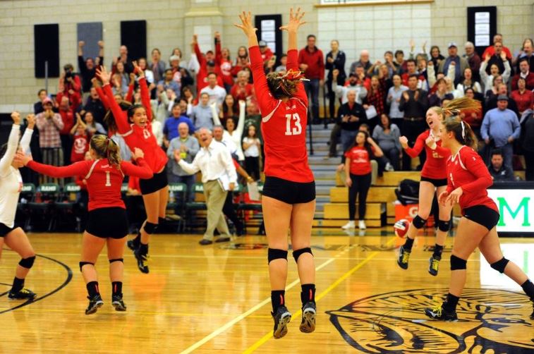 Barnstable players react after winning Division I South Sectional Title in Volleyball